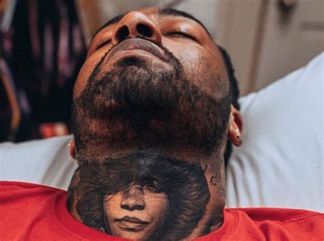 This tattoo includes a black and white inked Wolf&x27;s face with two different sides. . John wall neck tattoo